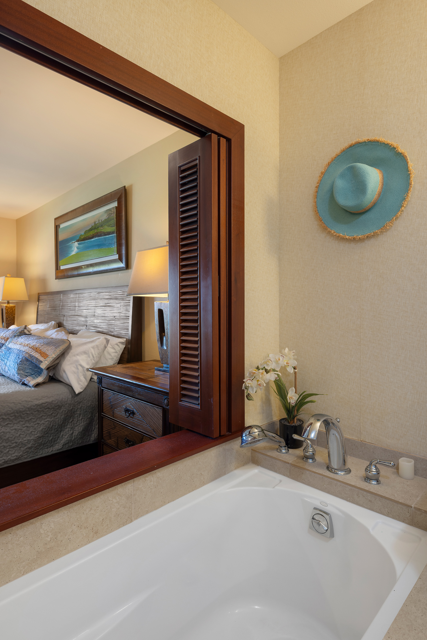 69-1033 Nawahine Place, Unit 4G Waikoloa, HI 96738 - Photo 15 of 26 a spacious bathroom with a granite countertop sink and a mirror