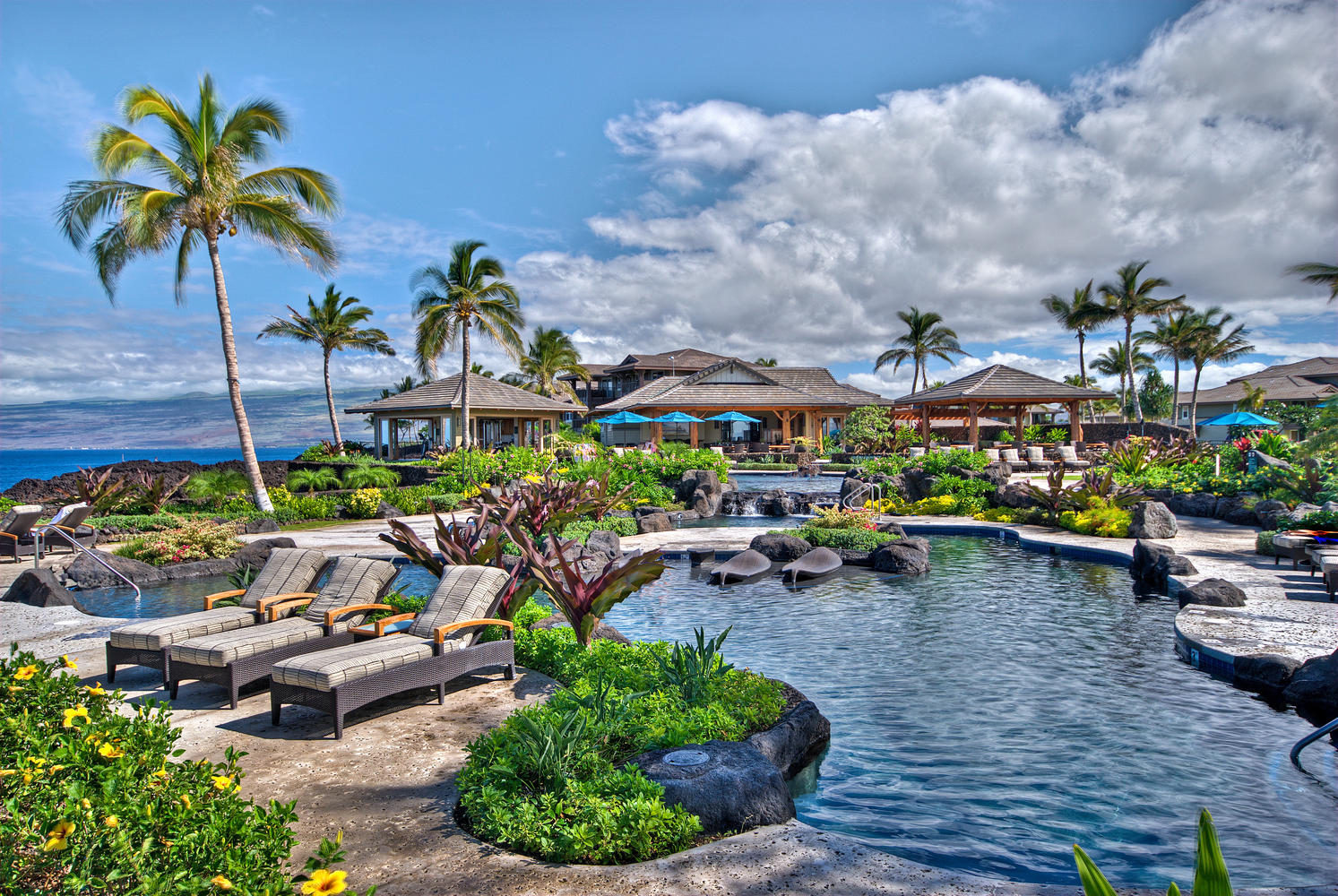 69-1033 Nawahine Place, Unit 4G Waikoloa, HI 96738 - Photo 22 of 26 a group of people sitting in a yard in a backyard