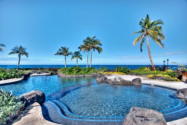 a view of a swimming pool and lounge chair