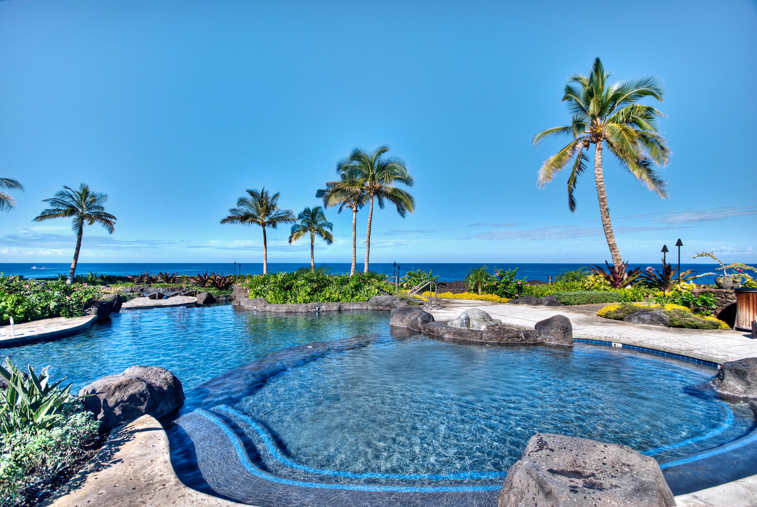 69-1033 Nawahine Place, Unit 4G Waikoloa, HI 96738 - Photo 23 of 26 a view of a swimming pool and lounge chair