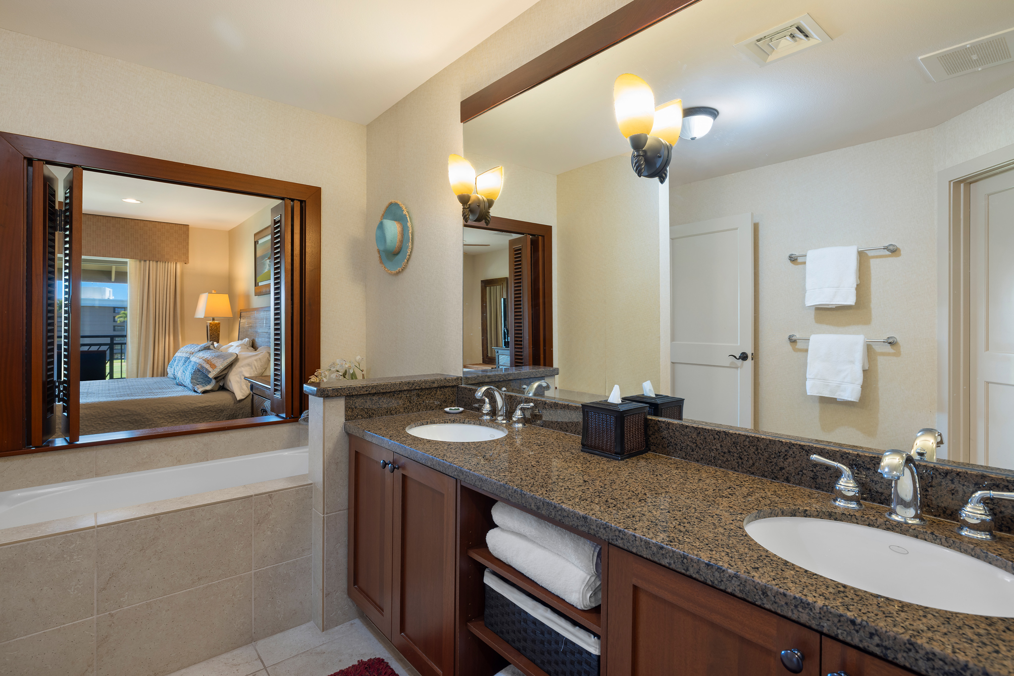 69-1033 Nawahine Place, Unit 4G Waikoloa, HI 96738 - Photo 5 of 26 a bathroom with double vanity sinks and a mirror