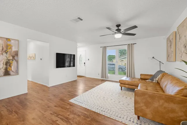 a living room with furniture and a window