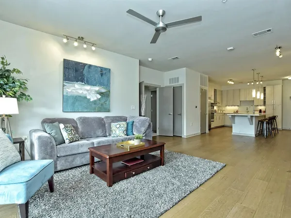 a living room with furniture and a table