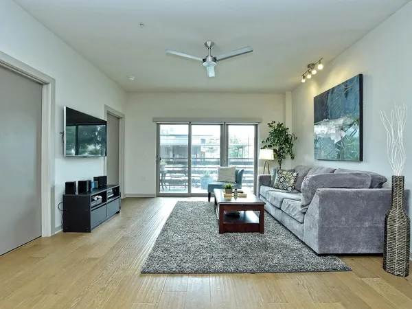 a living room with furniture and a large window