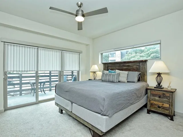 a bathroom with a sink a toilet a shower and a mirror