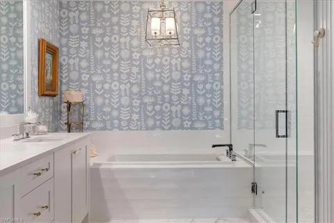 a bathroom with a bathtub and a sink