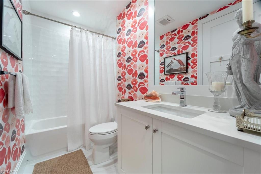 1135 3rd Avenue South, Unit 409 Naples, FL 34102 - Photo 31 of 44 a bathroom with a sink toilet and shower