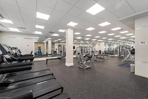 a view of a patio with swimming pool table and chairs