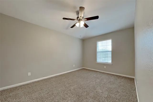 a view of empty room with windows