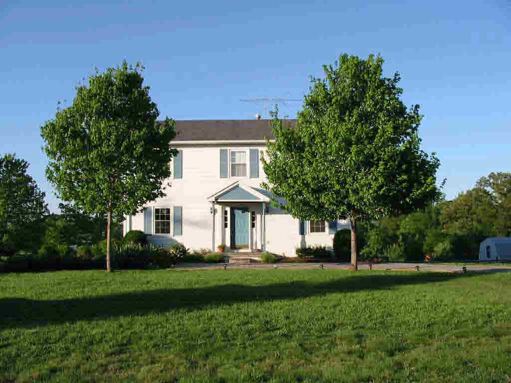860 Cedar Grove Road Ruckersville, VA 22968 - Photo 3 of 4 a front view of a house with a yard