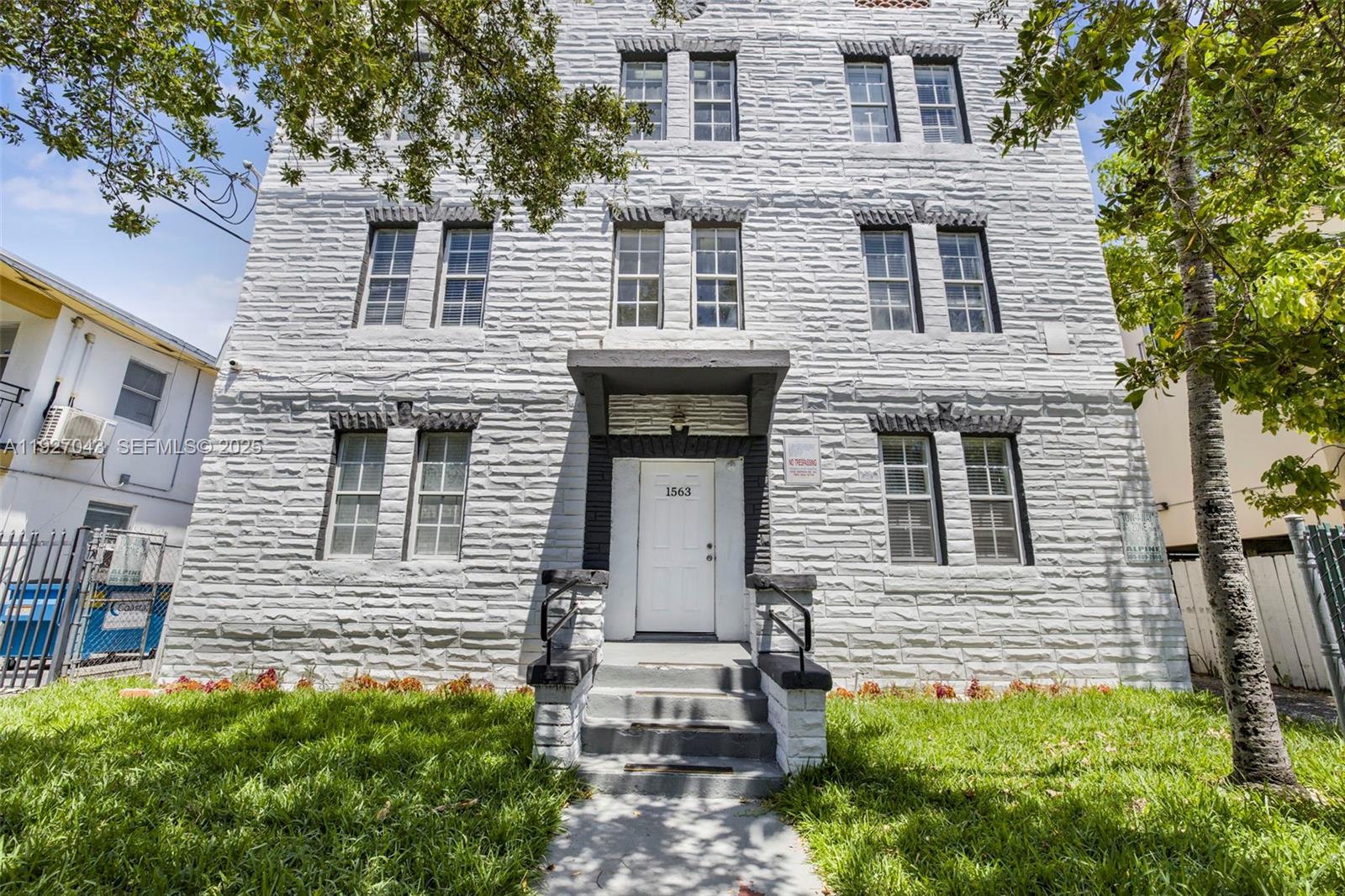 1563 Southwest 2nd Street, Unit 7 Miami, FL 33135 - Photo 1 of 2 front view of a house with a yard