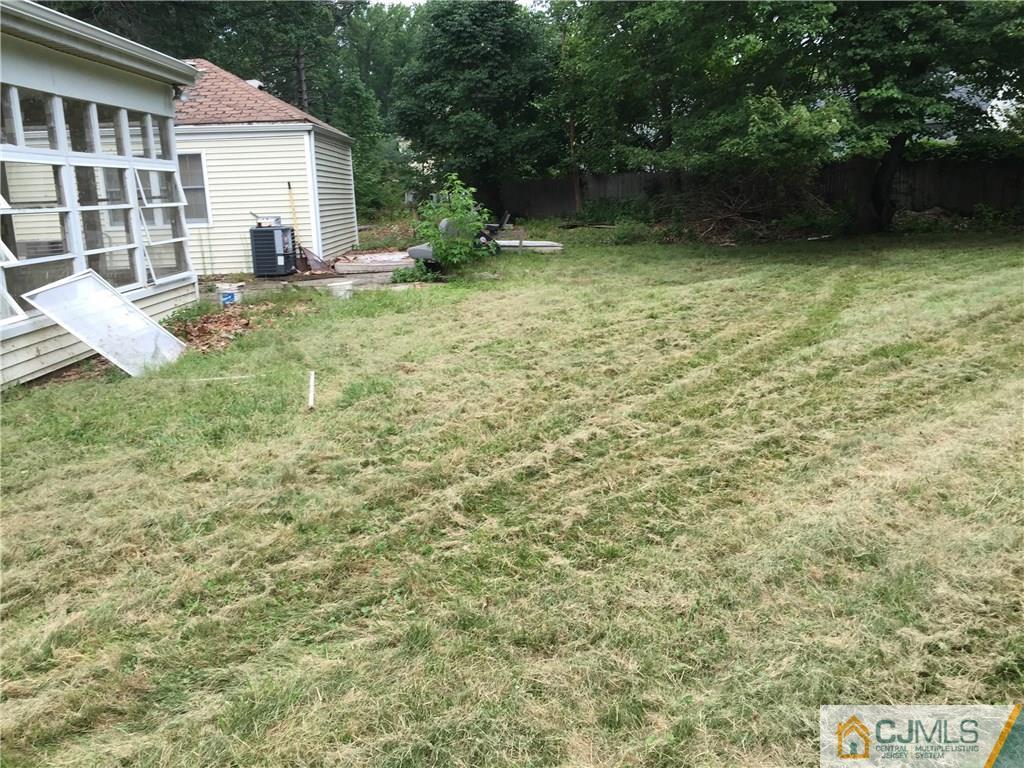 27 Richard Road Edison, NJ 08820 - Photo 5 of 5 a view of a house with backyard and garden