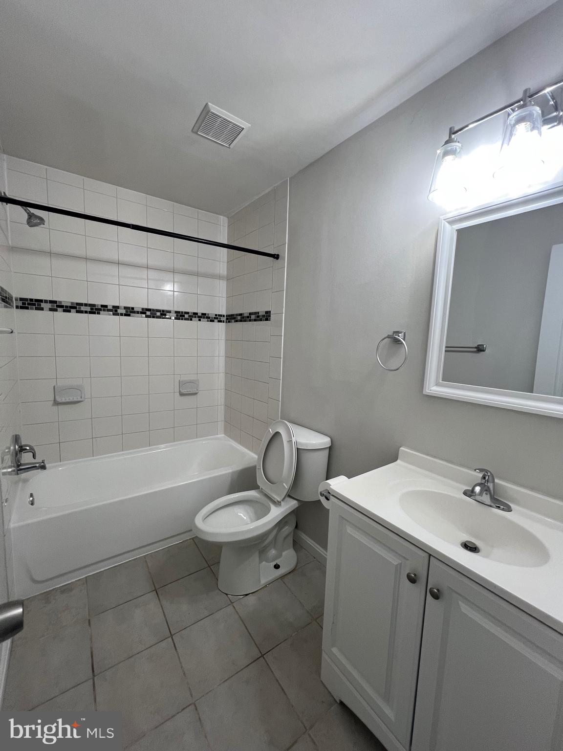 6604 Suitland Road Suitland, MD 20746 - Photo 26 of 27 a bathroom with a sink a toilet and bathtub