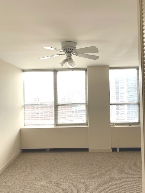 655 West Irving Park Road, Unit 1104 Chicago, IL 60613 - Photo 11 of 26 a view of an empty room with a window