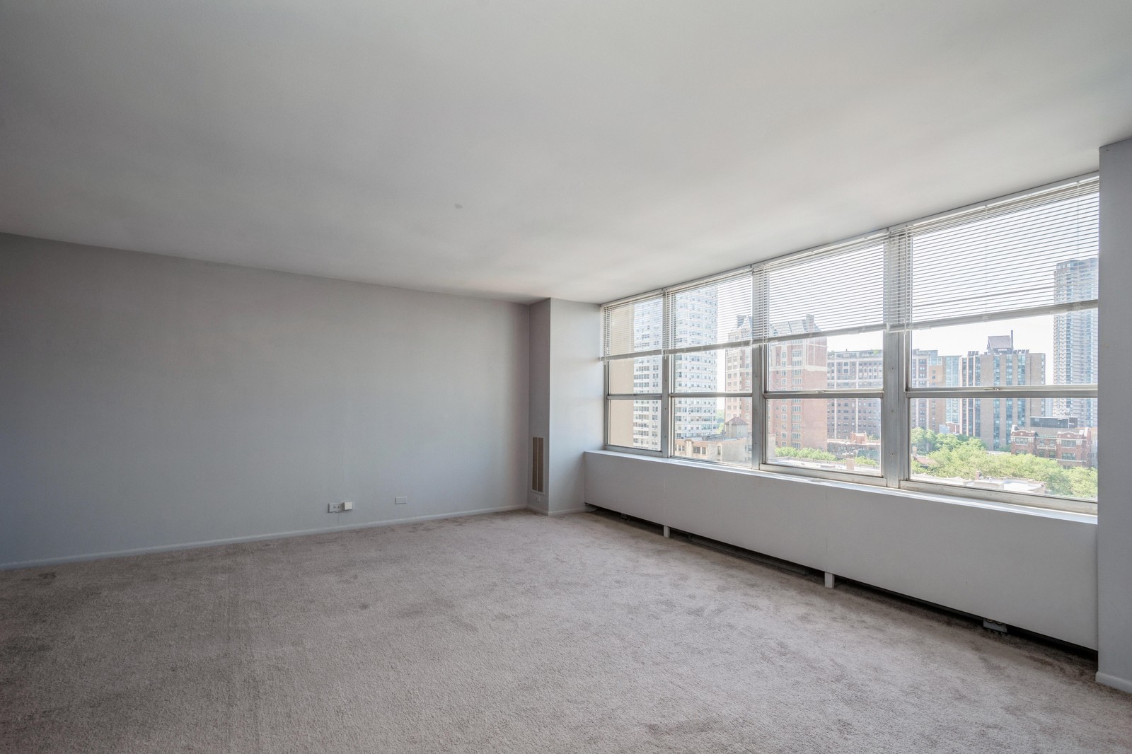 655 West Irving Park Road, Unit 1104 Chicago, IL 60613 - Photo 12 of 26 an empty room with a window