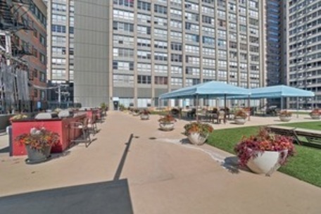 655 West Irving Park Road, Unit 1104 Chicago, IL 60613 - Photo 18 of 26 a view of a swimming pool with outdoor seating