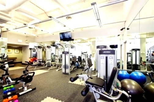 655 West Irving Park Road, Unit 1104 Chicago, IL 60613 - Photo 20 of 26 a view of a room with gym equipment