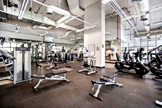 655 West Irving Park Road, Unit 1104 Chicago, IL 60613 - Photo 21 of 26 a view of a room with gym equipment
