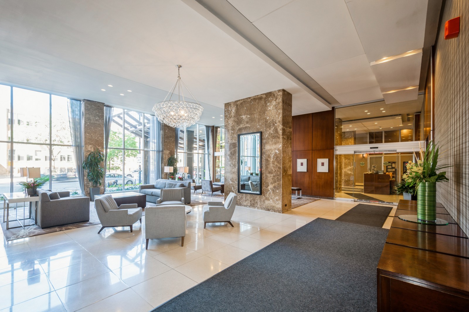 655 West Irving Park Road, Unit 1104 Chicago, IL 60613 - Photo 3 of 26 a living room with furniture large windows and wooden floor