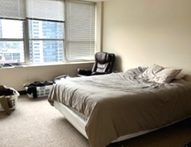 655 West Irving Park Road, Unit 1104 Chicago, IL 60613 - Photo 10 of 26 a bedroom with a bed and a window