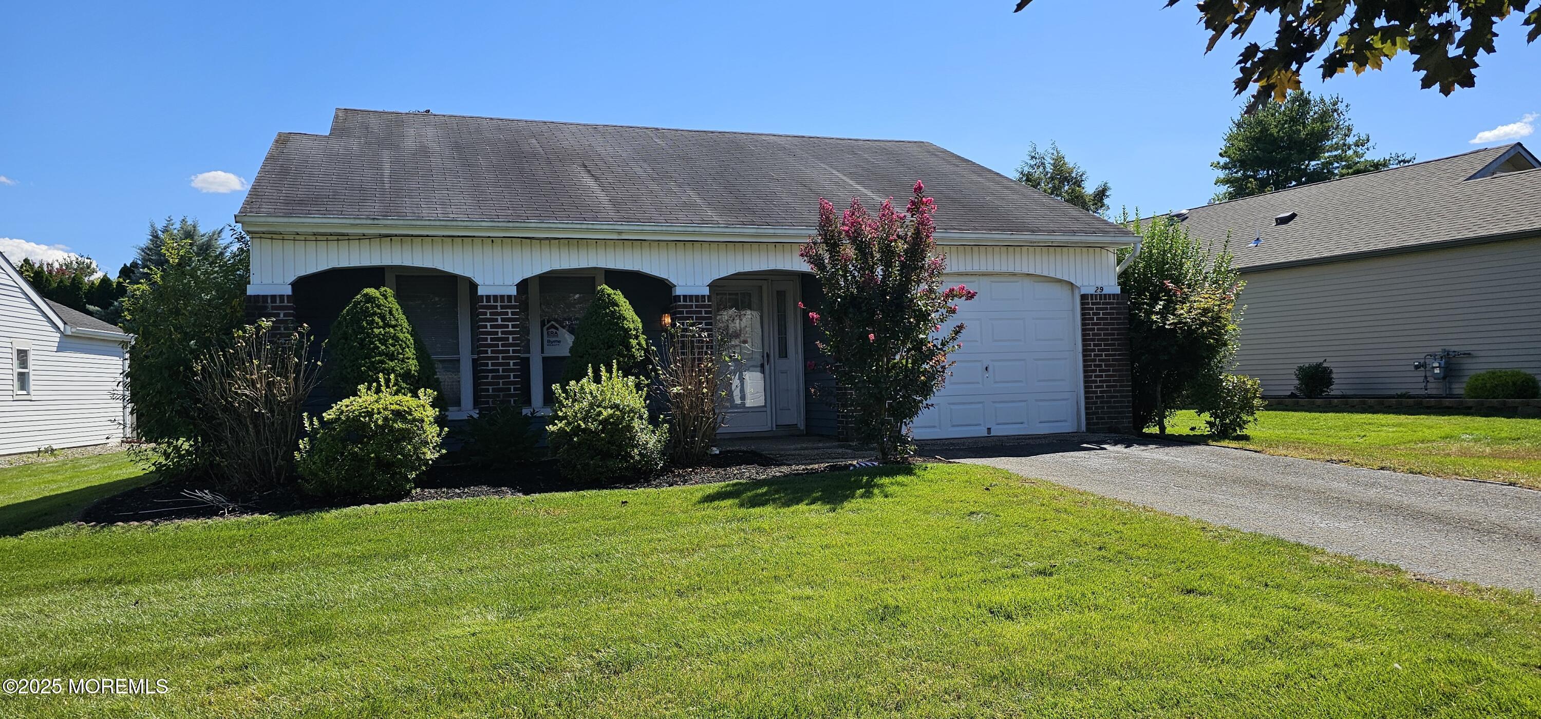 29 Hastings Road Manchester Township, NJ 08759 - Photo 1 of 14 a front view of a house with garden