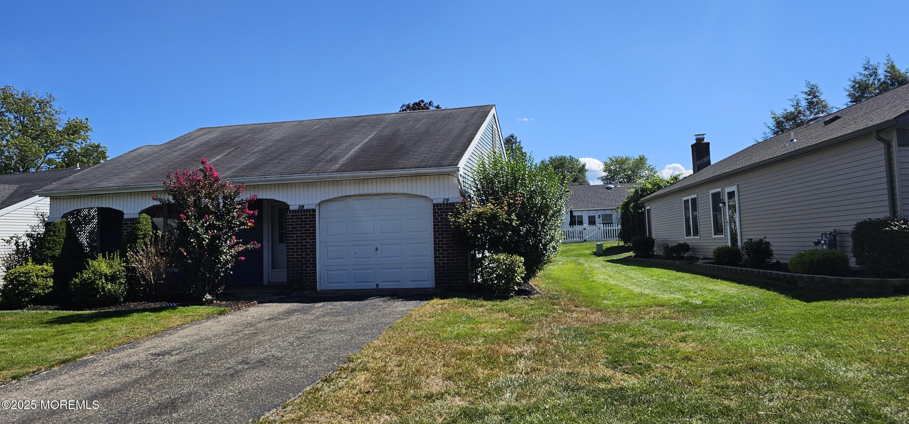 29 Hastings Road Manchester Township, NJ 08759 - Photo 2 of 14 a front view of house with yard and green space