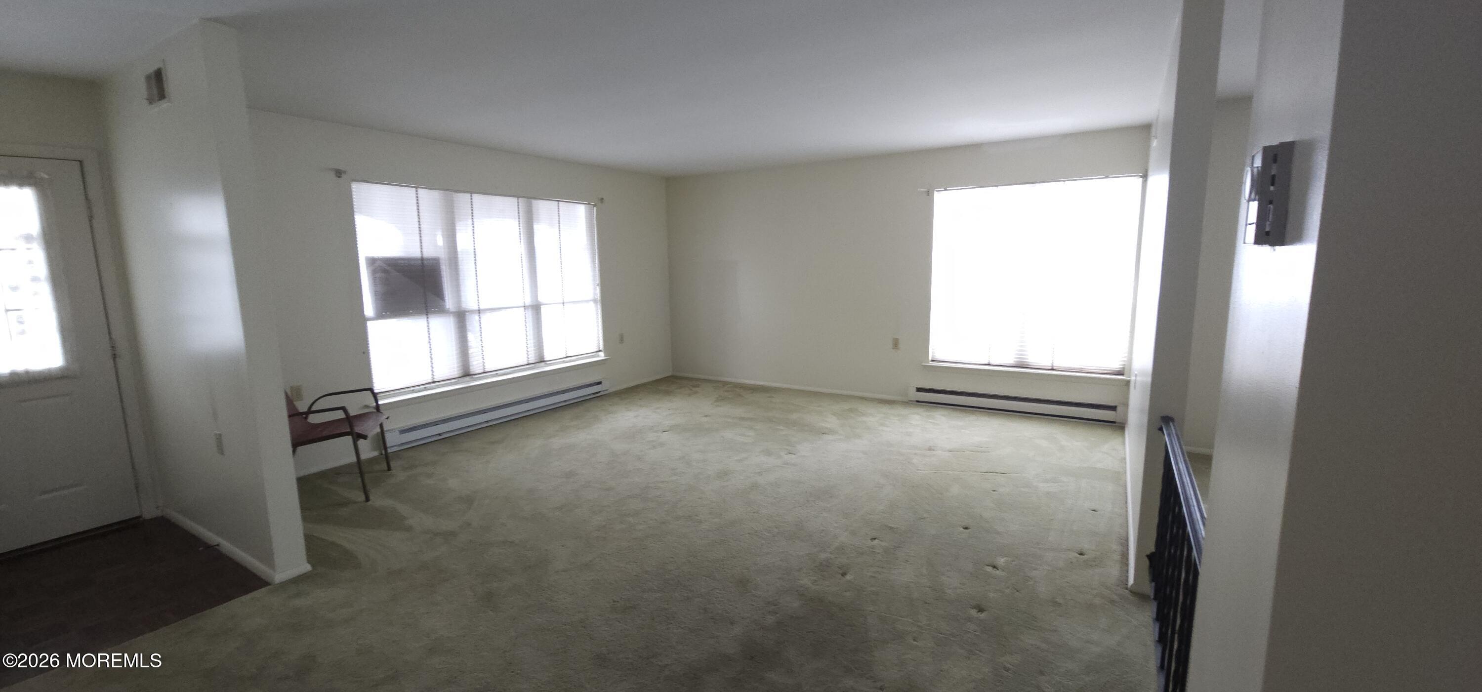 29 Hastings Road Manchester Township, NJ 08759 - Photo 4 of 14 an empty room with windows