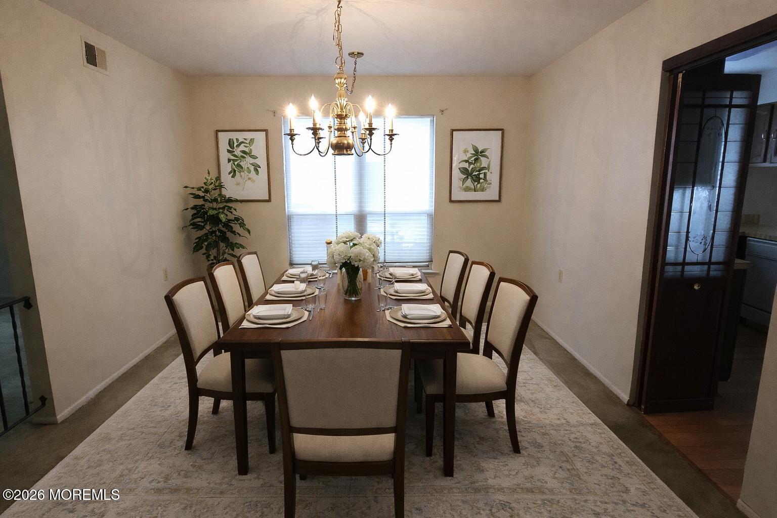 29 Hastings Road Manchester Township, NJ 08759 - Photo 5 of 14 a view of a dining room with furniture a chandelier and wooden floor