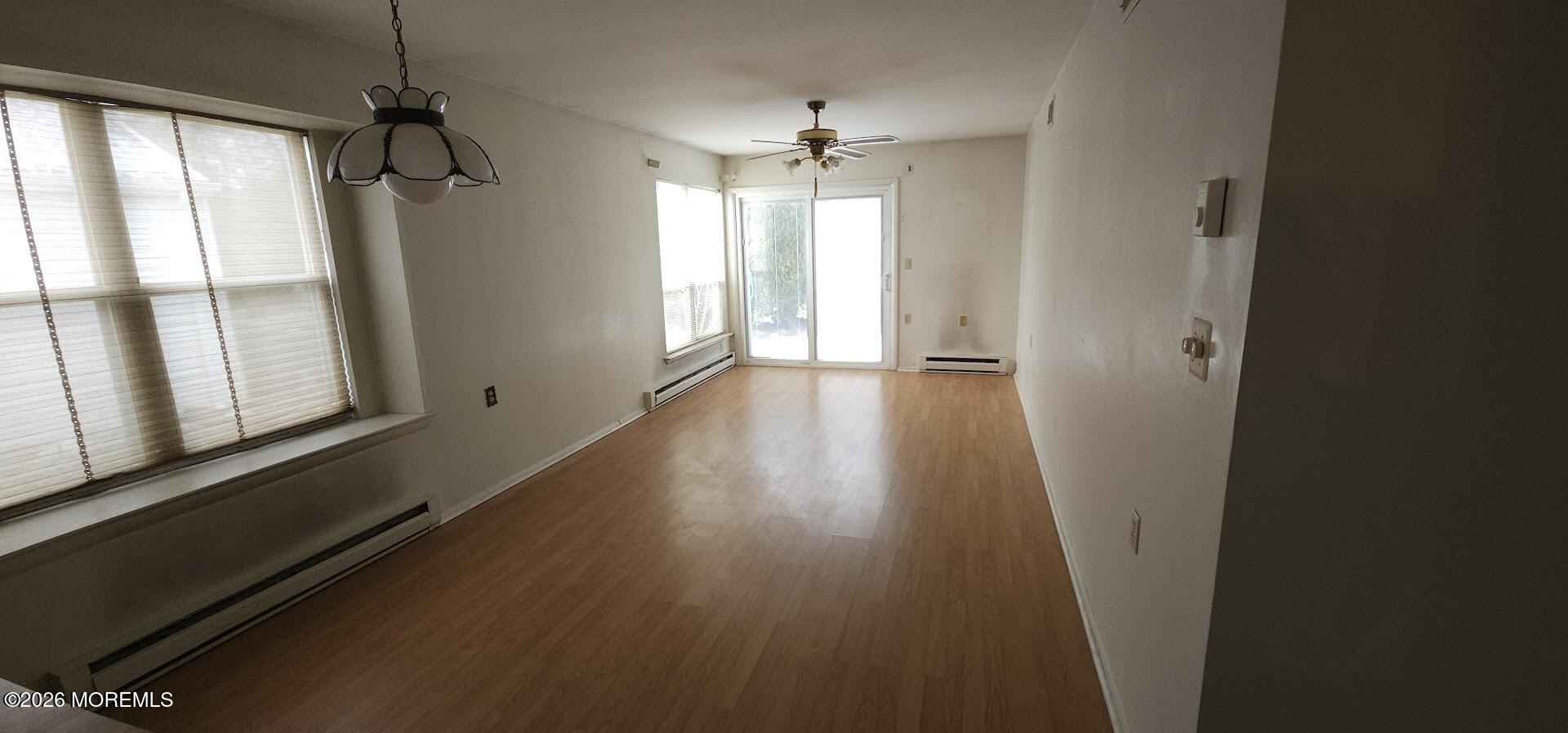 29 Hastings Road Manchester Township, NJ 08759 - Photo 10 of 14 a view of an empty room with wooden floor and a window