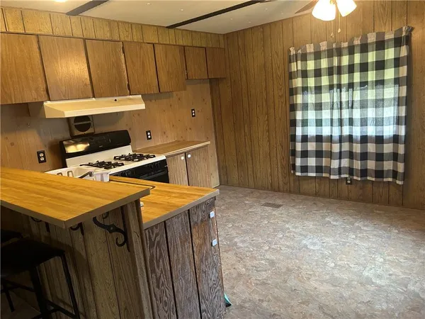 a kitchen with a stove and a sink