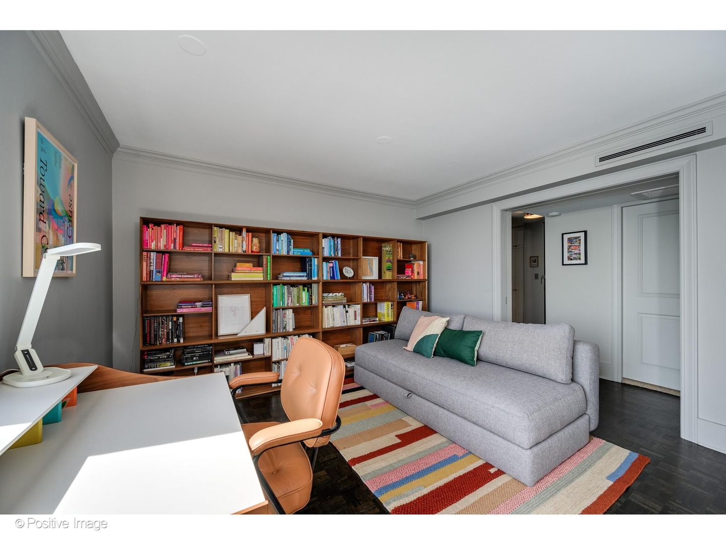 1310 North Ritchie Court, Unit 26C Chicago, IL 60610 - Photo 22 of 34 a living room with furniture and a book shelf