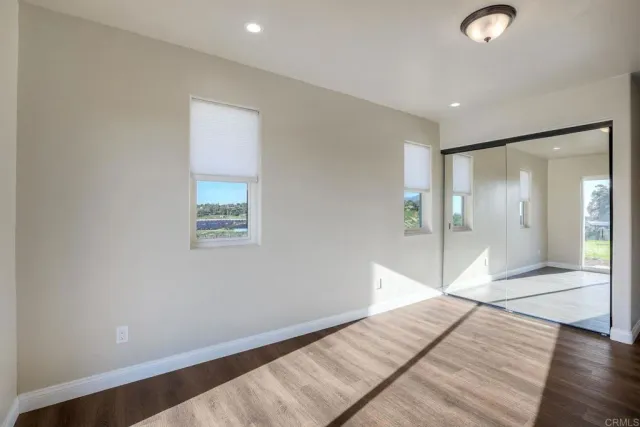 a white bath tub sitting next to a white toilet