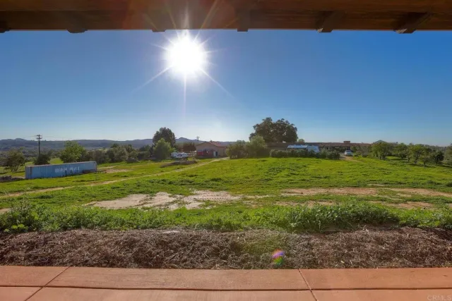 a view of a backyard with porch
