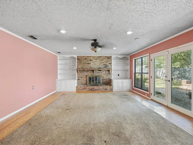 a view of a kitchen with a sink and wooden floor