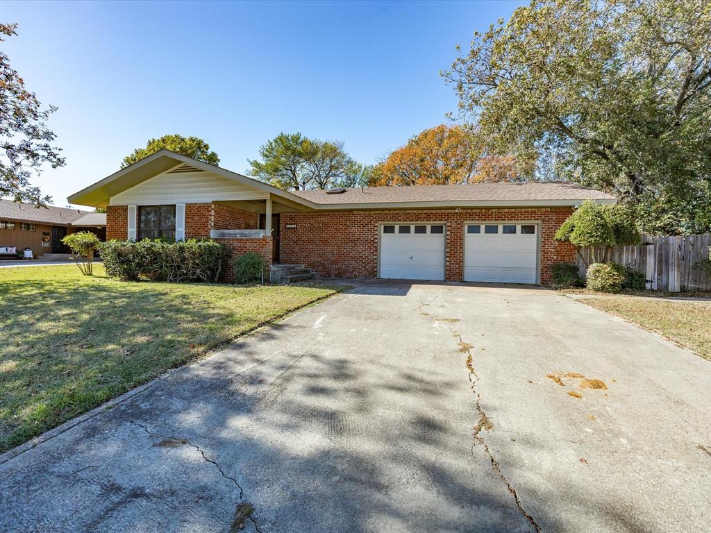 1104 Coffield Street Bowie, TX 76230 - Photo 38 of 39 a front view of a house with a yard