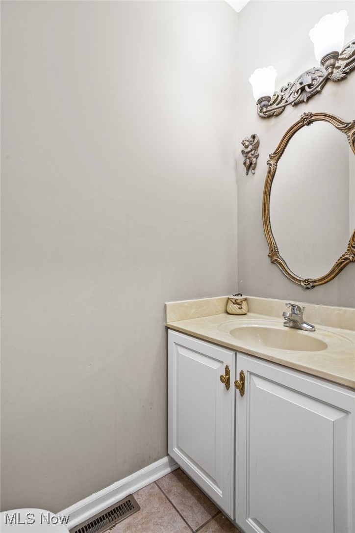 11620 Friendsville Road Creston, OH 44217 - Photo 22 of 40 1st floor 1/2 Bathroom featuring vanity and tile patterned floors