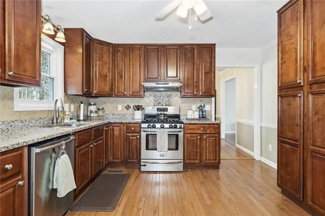 a bathroom with a sink toilet and mirror