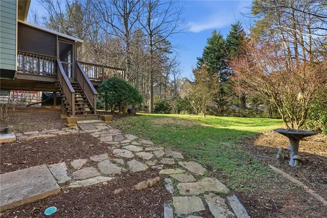 a view of a tennis ground with a yard