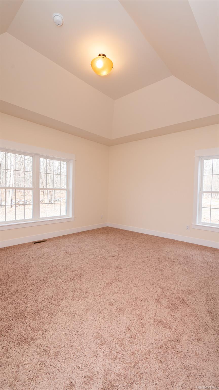 43 Malloy Road Wallkill, NY 12589 - Photo 26 of 50 Empty room featuring vaulted ceiling and light carpet