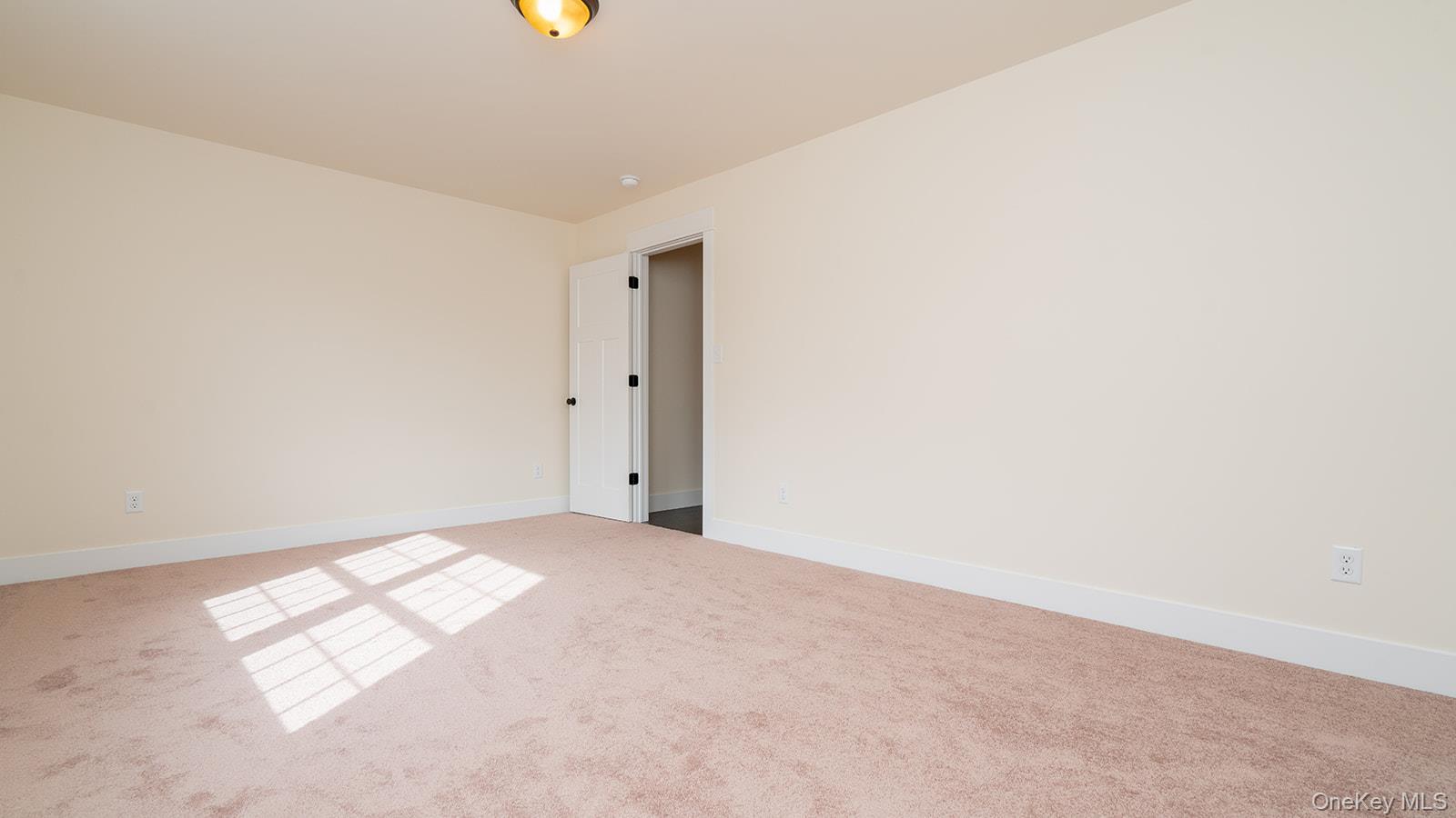 43 Malloy Road Wallkill, NY 12589 - Photo 32 of 50 Carpeted spare room featuring baseboards