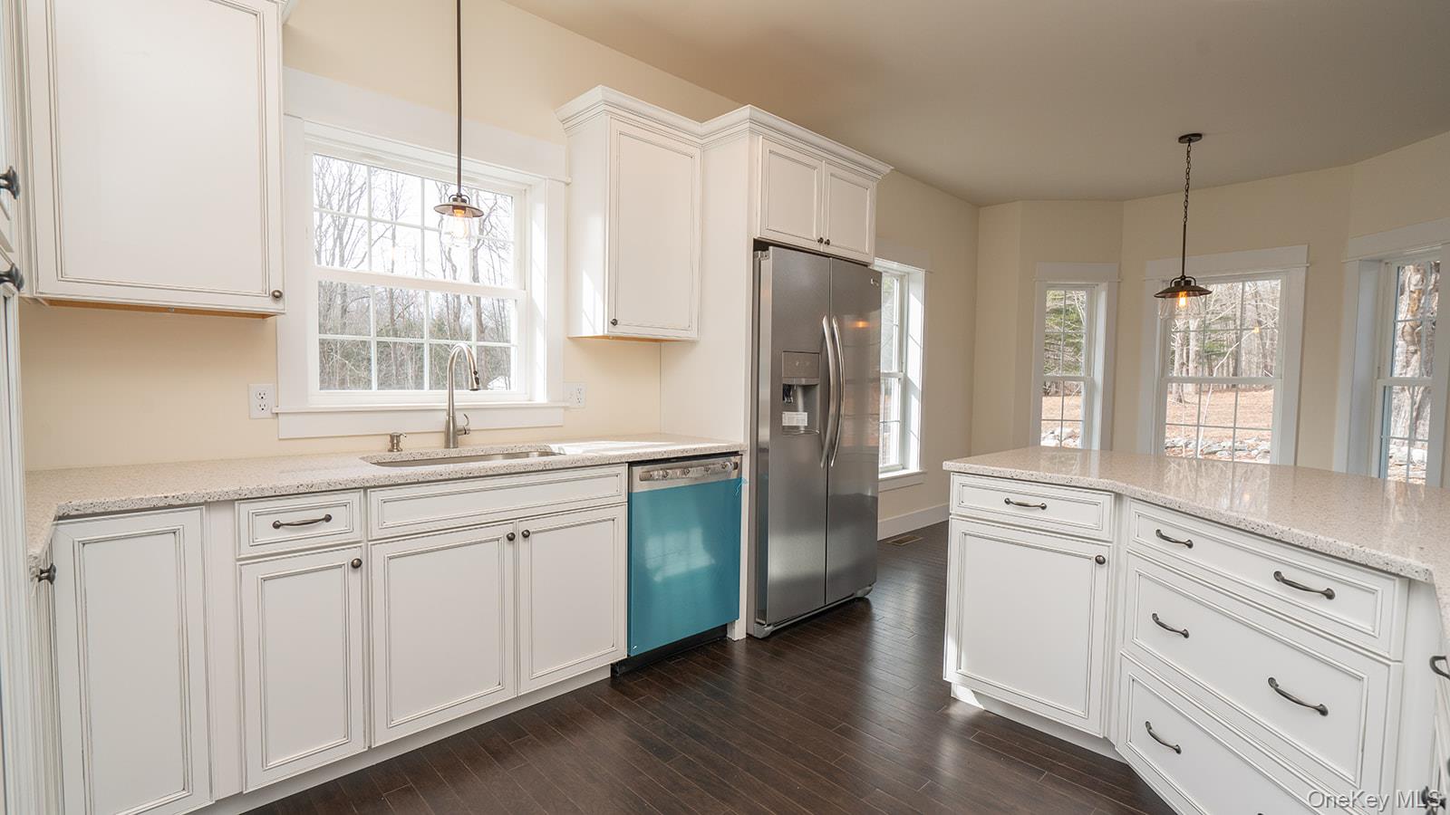 43 Malloy Road Wallkill, NY 12589 - Photo 4 of 50 Kitchen featuring white cabinetry, stainless steel fridge with ice dispenser, pendant lighting, and dishwashing machine