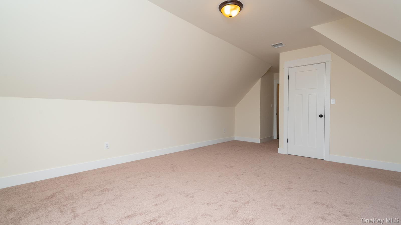 43 Malloy Road Wallkill, NY 12589 - Photo 43 of 50 Bonus room with vaulted ceiling and light colored carpet