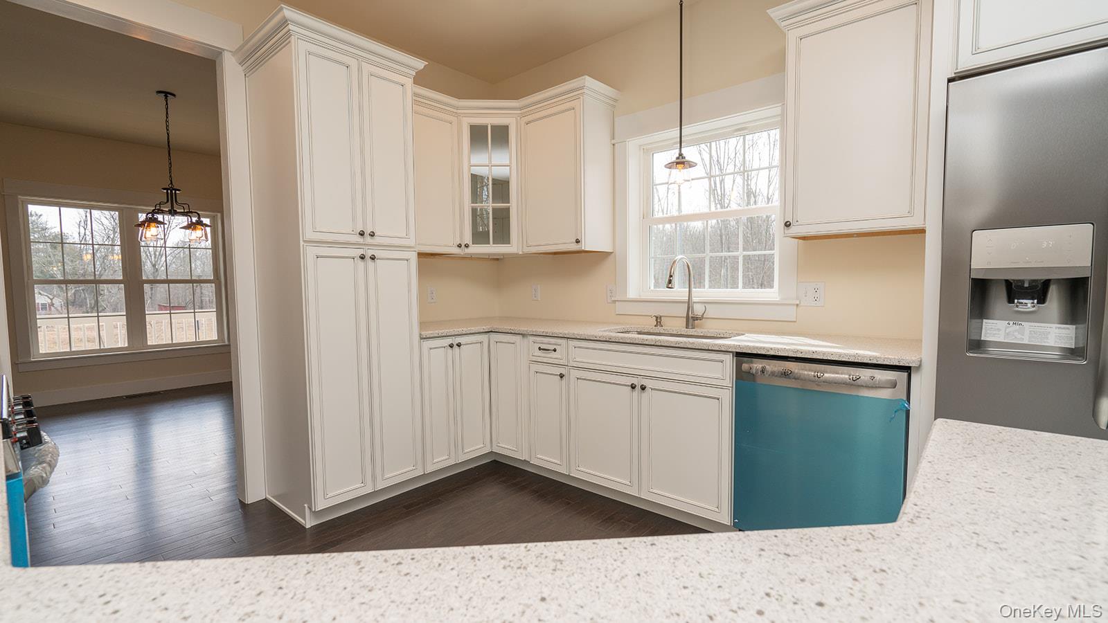 43 Malloy Road Wallkill, NY 12589 - Photo 6 of 50 Kitchen featuring stainless steel fridge with ice dispenser, dishwasher, glass insert cabinets, a chandelier, and hanging light fixtures