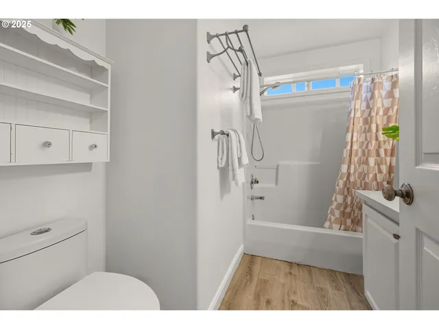 a bathroom with a shower and a toilet