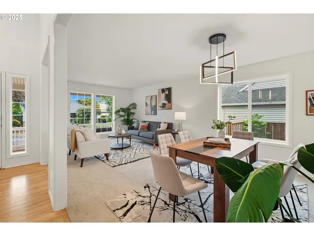 a living room with furniture a flat screen tv and a large window