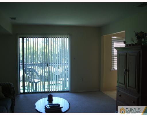 1530 Raspberry Court Edison, NJ 08817 - Photo 8 of 8 a living room with furniture and a potted plant