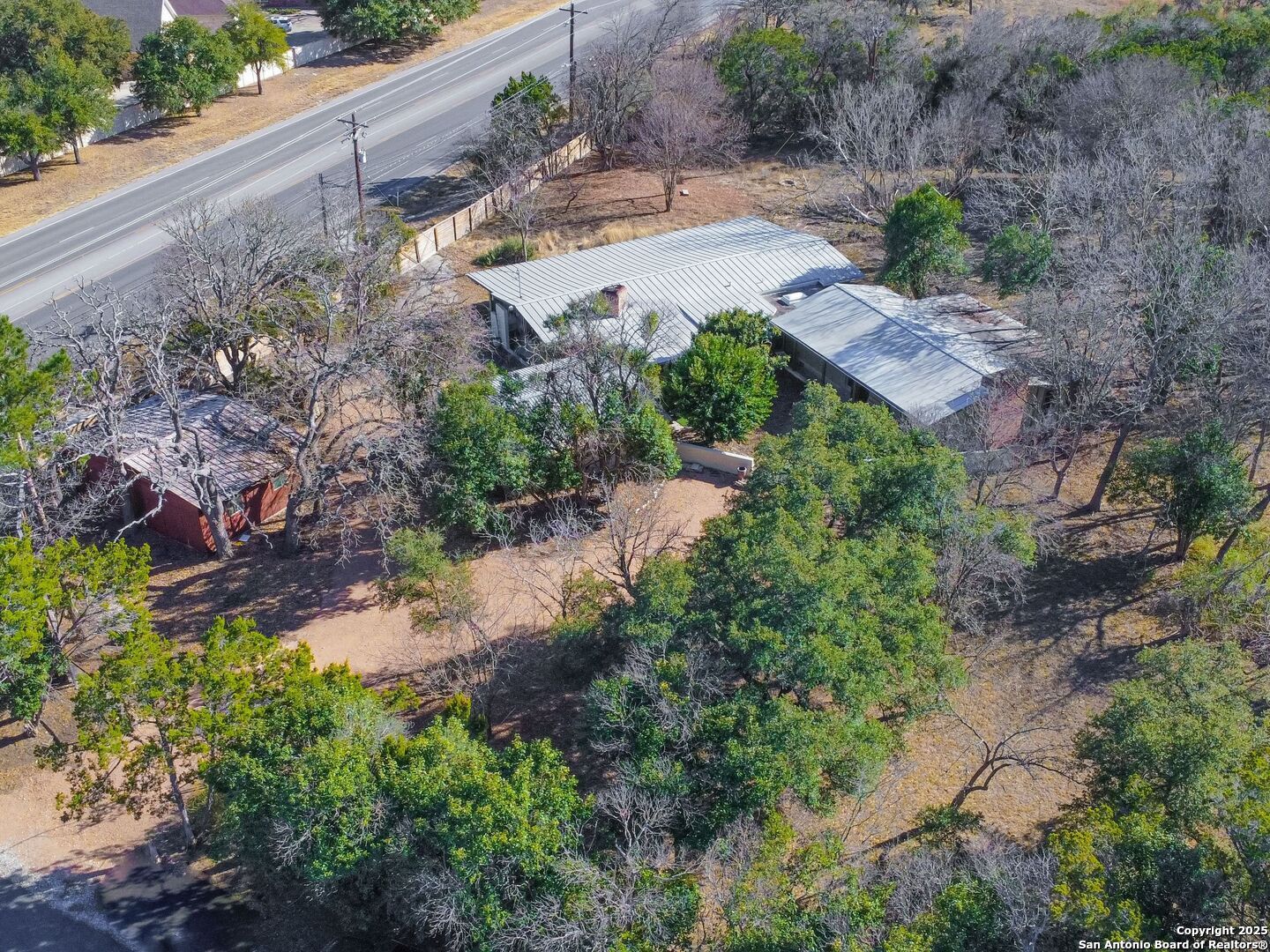 142 Royal Oaks Road Kerrville, TX 78028 - Photo 12 of 17 a view of a yard with plants and large trees