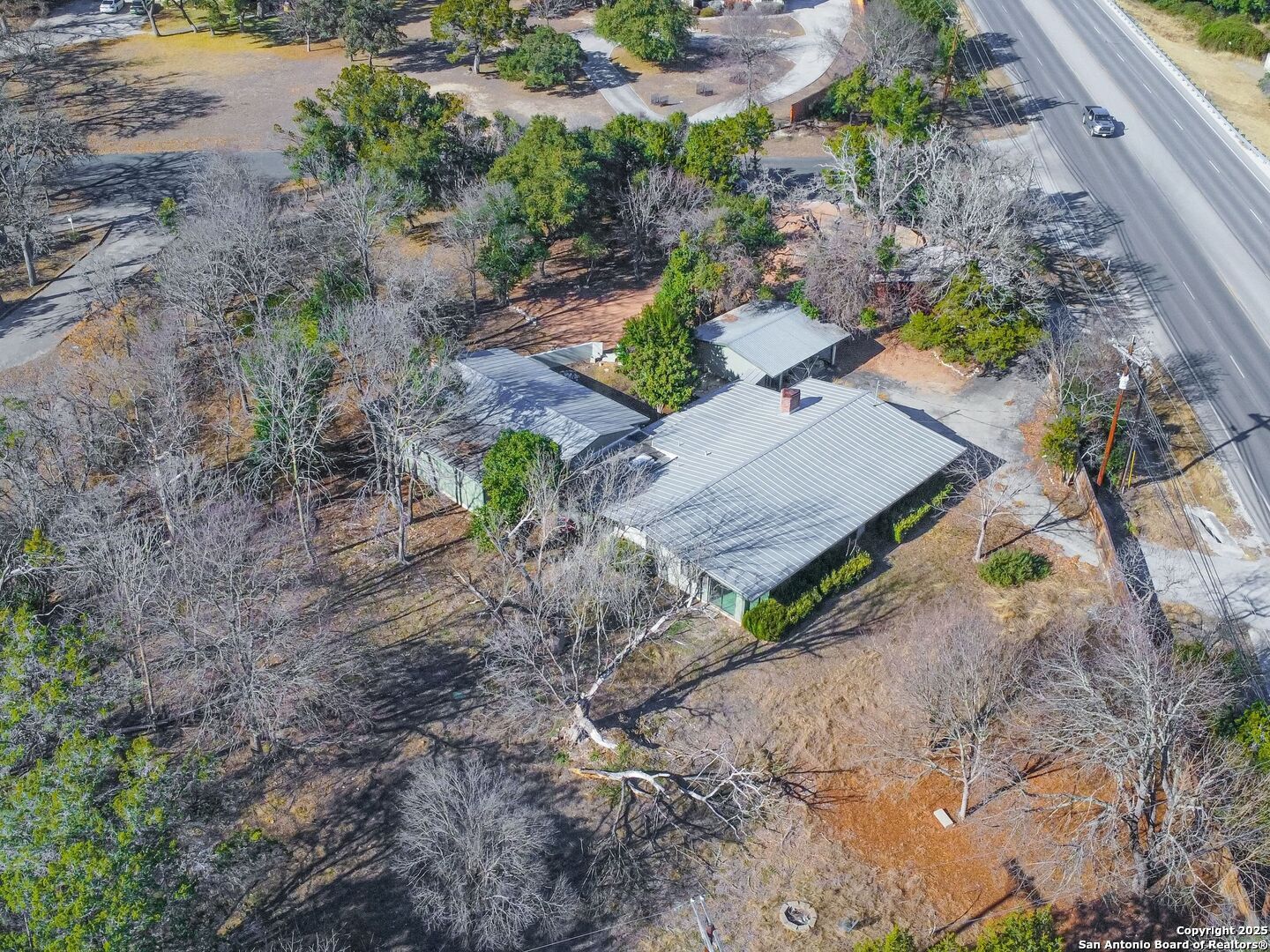 142 Royal Oaks Road Kerrville, TX 78028 - Photo 16 of 17 a view of a yard and mountain