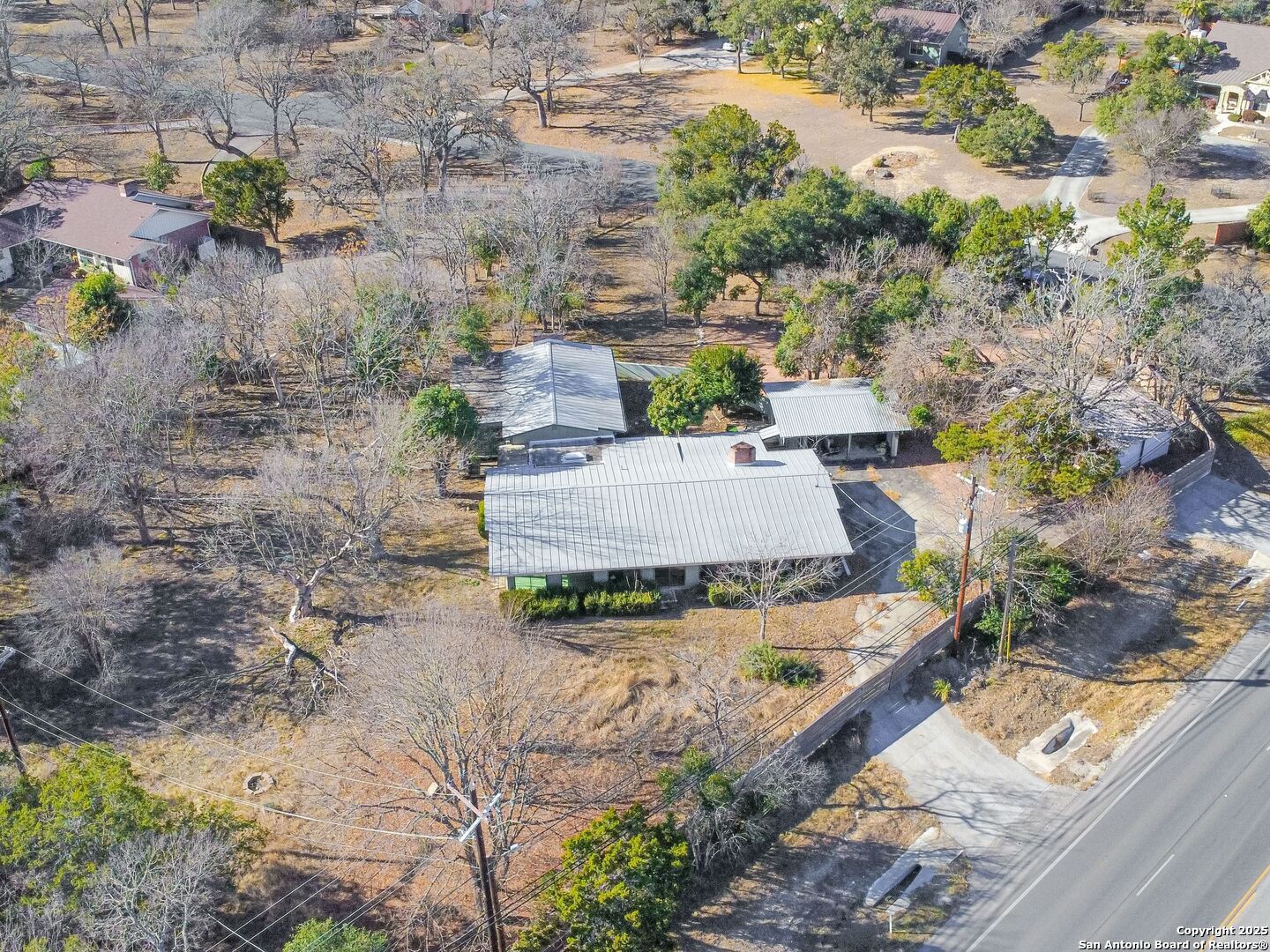 142 Royal Oaks Road Kerrville, TX 78028 - Photo 6 of 17 an aerial view of a house with a yard and lake