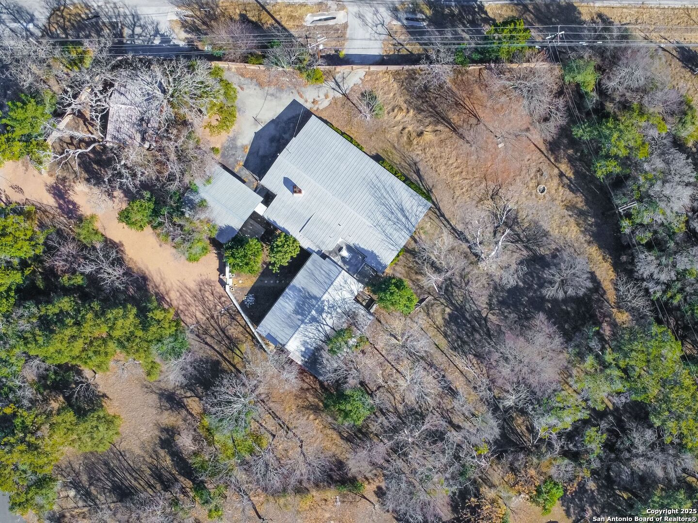 142 Royal Oaks Road Kerrville, TX 78028 - Photo 7 of 17 a aerial view of a house with a yard